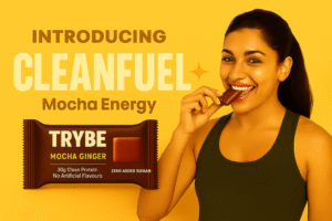 Woman smiling while holding TRYBE Mocha Energy bar – 30g clean protein with zero added sugar.